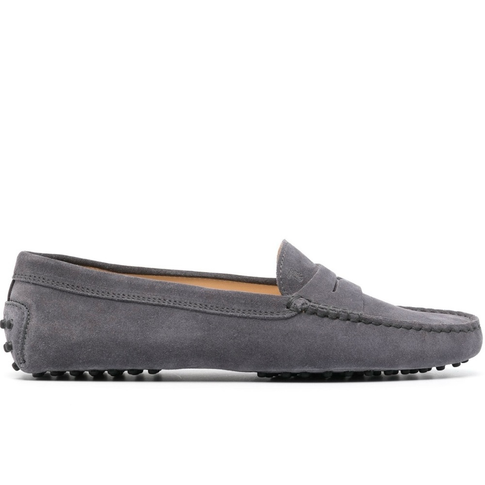 Grey suede slip-on loafers from Tod's featuring a ridged rubber sole
